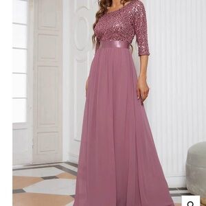 Formal chiffon and sequined formal dress. Fits like a
16. NEW AND NEVER WORN.